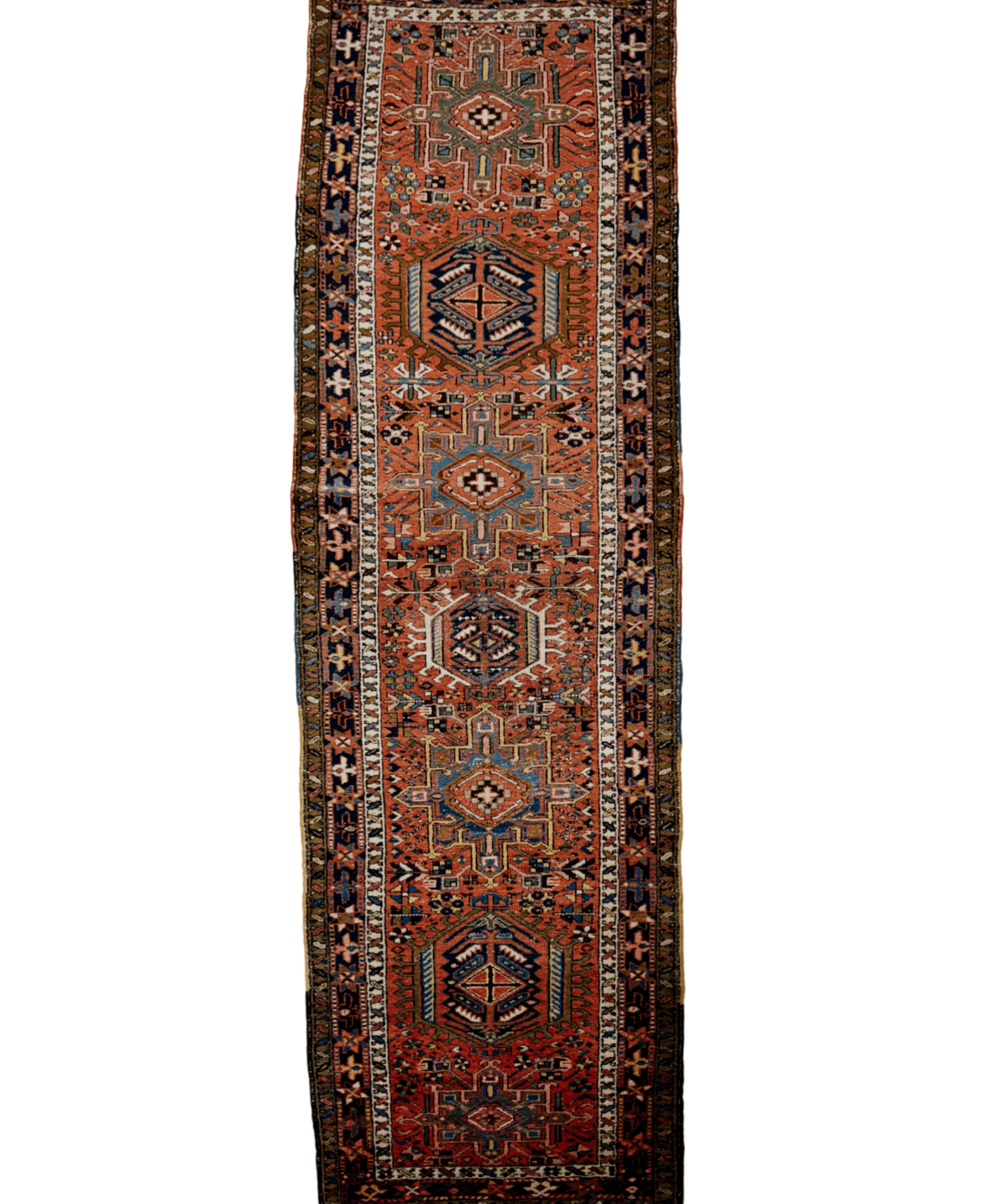 Persian-style runner rug with rust, navy, and beige geometric medallion pattern.