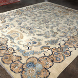 Persian Kashan rug laid flat with cream background, blue and tan floral corner motifs