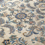 Persian Kashan rug wide view of ornate scrolling vines and floral bursts in blue