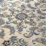 Persian Kashan rug wide view of ornate scrolling vines and floral bursts in blue