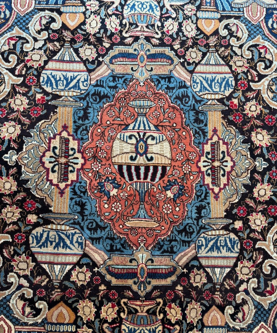 Close-up Persian Kashmar rug section with central red medallion on blue field
