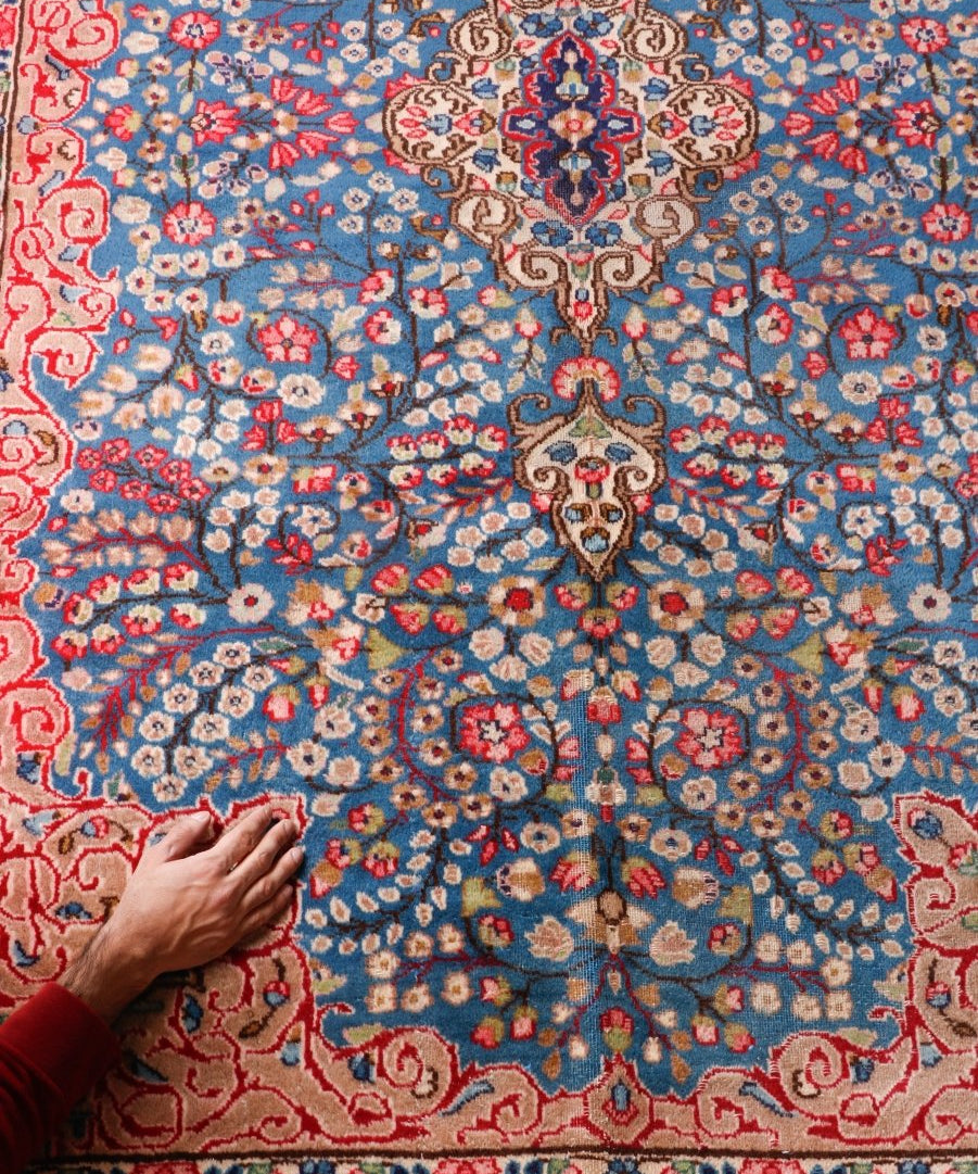 Persian-style rug flat weave with central blue field and ornate red-and-cream accents