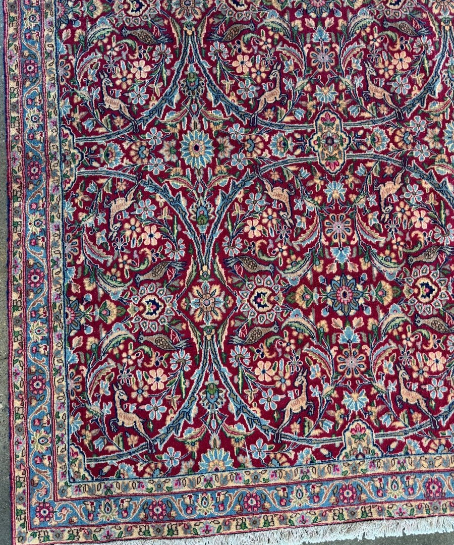 Persian Kerman rug with teal and red medallion pattern and ornate border detail