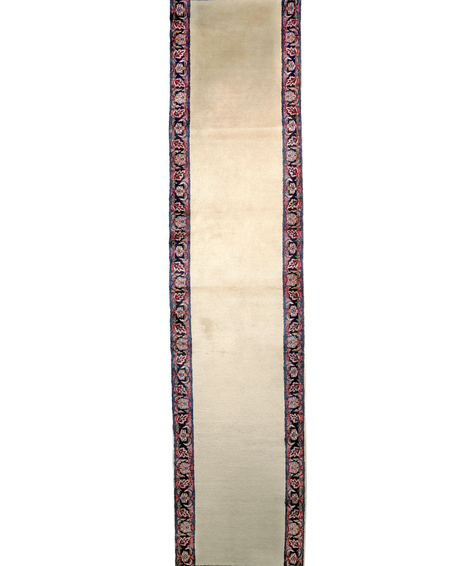 Cream runner rug end view with dark blue border and red ornamental pattern