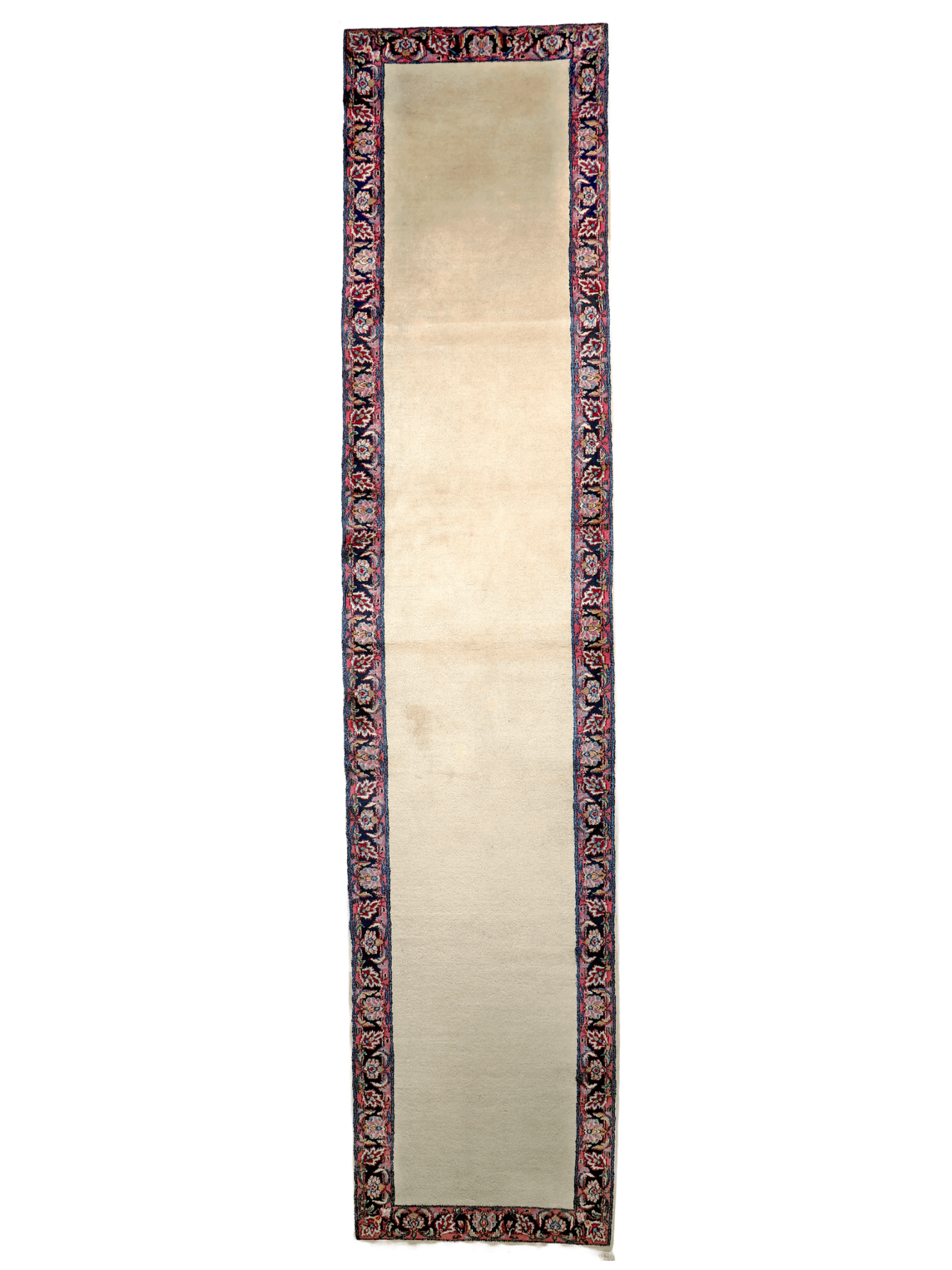 Cream runner rug end view with dark blue border and red ornamental pattern