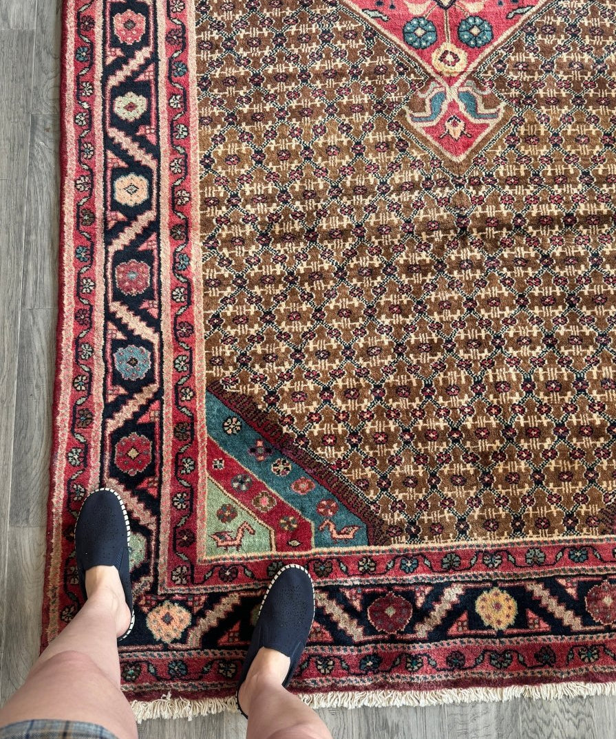 Persian Koliai rug with red border, blue diamond motifs, and beige patterned field