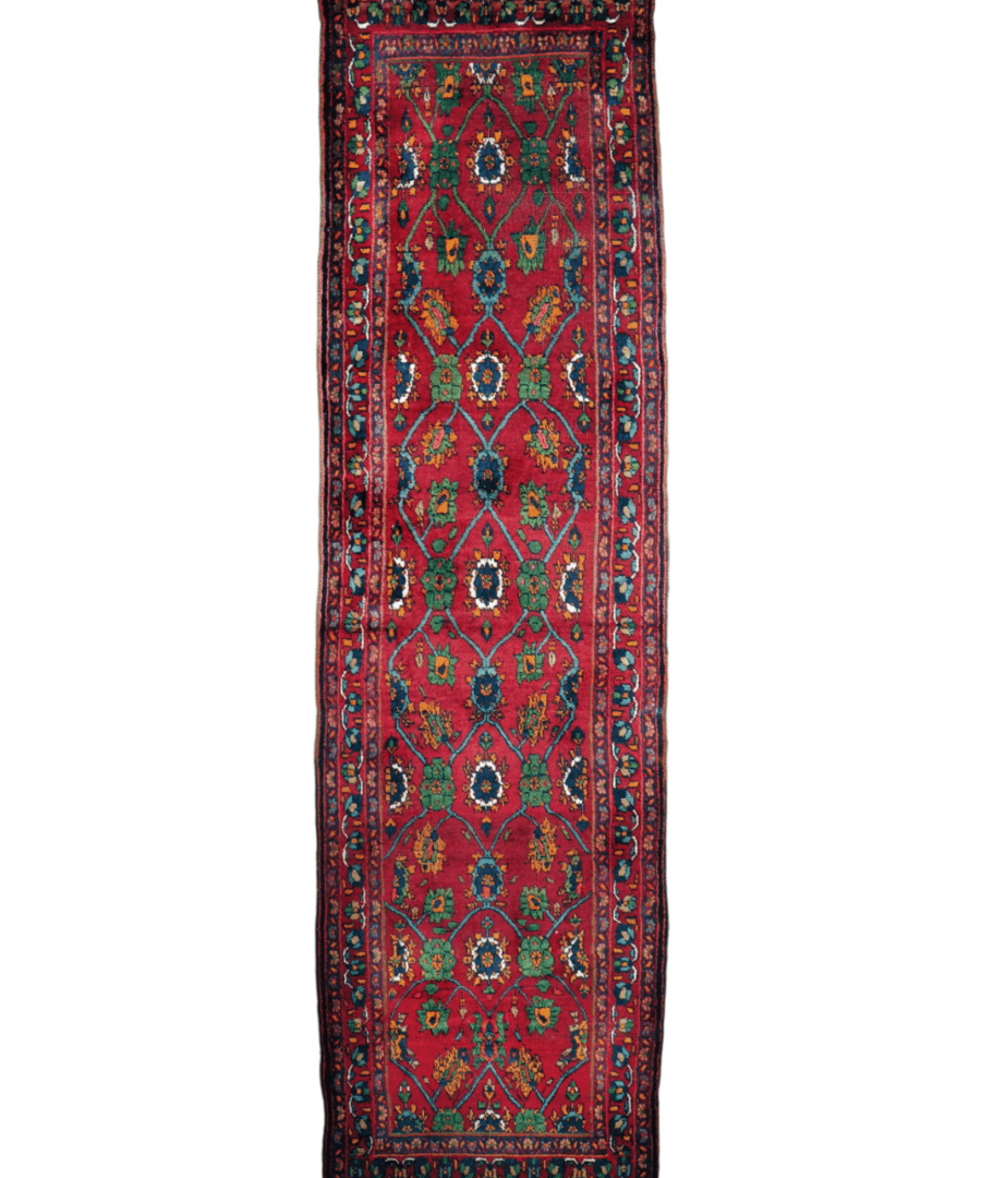 Rectangular red runner rug with teal and green medallion pattern and dark blue border