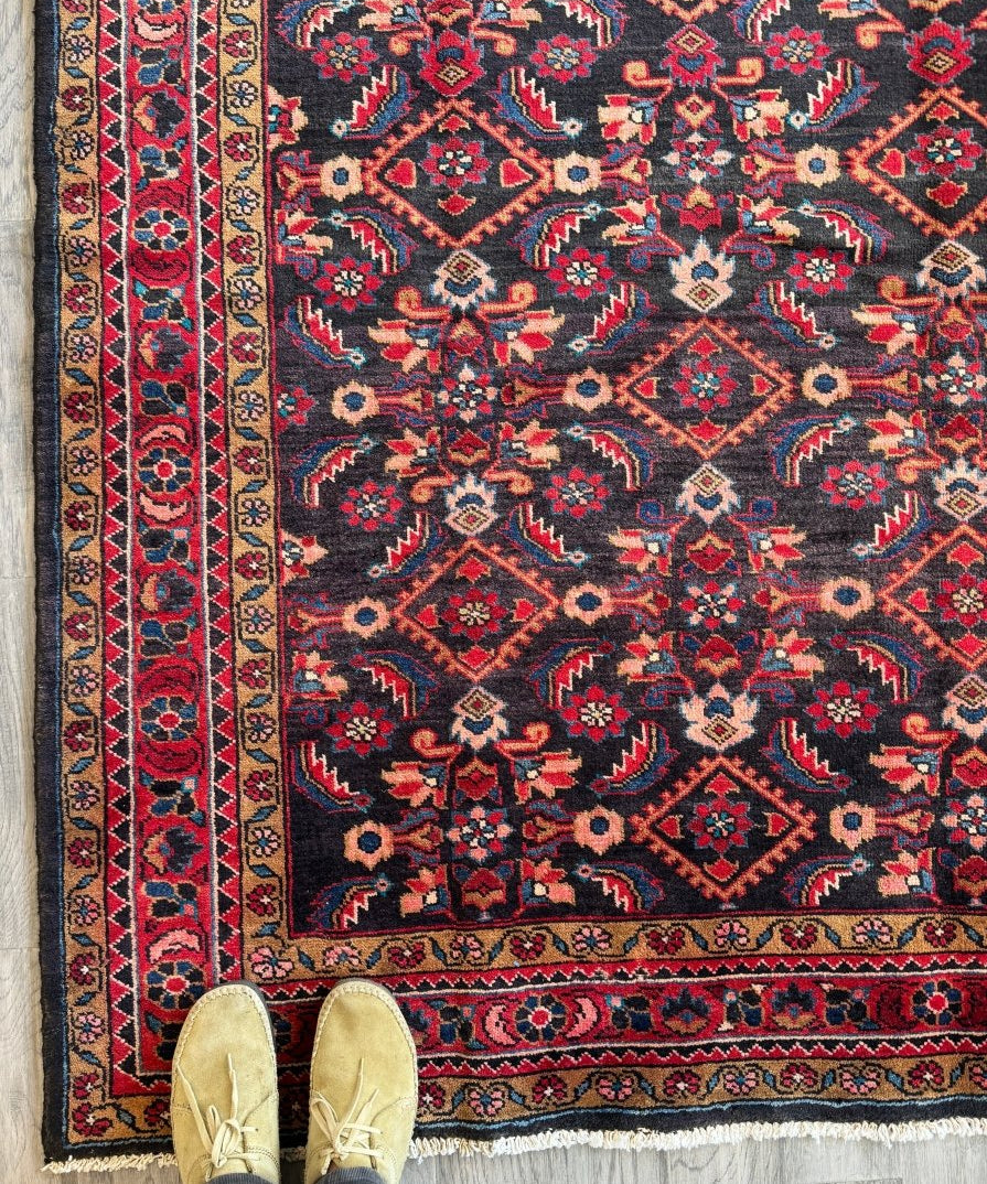 Multicolor Persian-style area rug with geometric medallions and border pattern