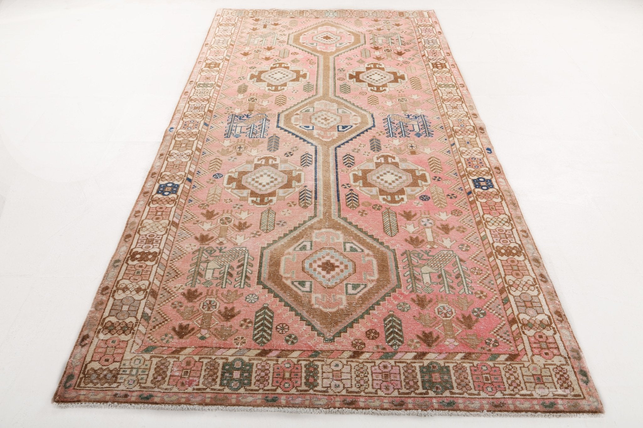 Persian Mahal rug full view from above, dusty pink with beige and teal geometric motifs