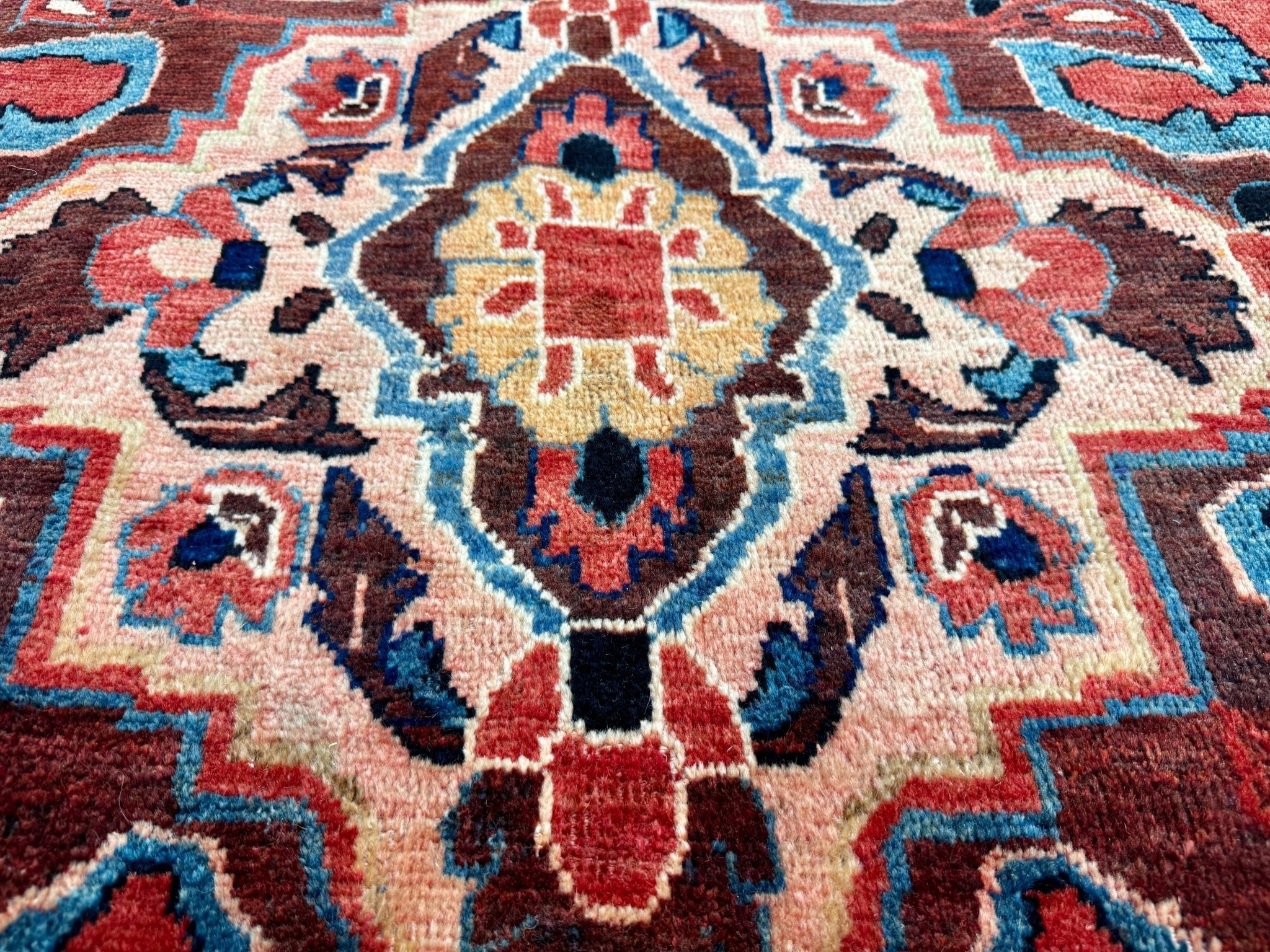 Persian Mahal area rug with red, teal, blue and cream ornate central medallion