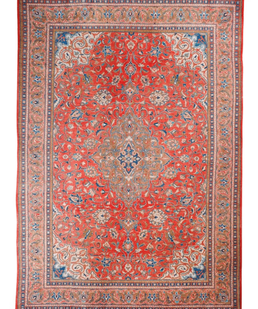 Rectangular Persian-style rug with red floral pattern, blue accents, and decorative border