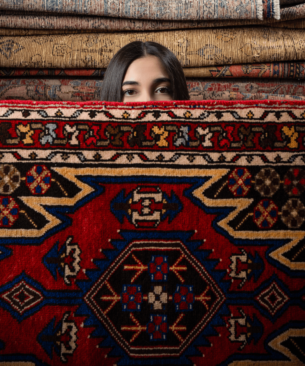 Persian Mazlaghan rug stacked view with red center medallion and ornate frame