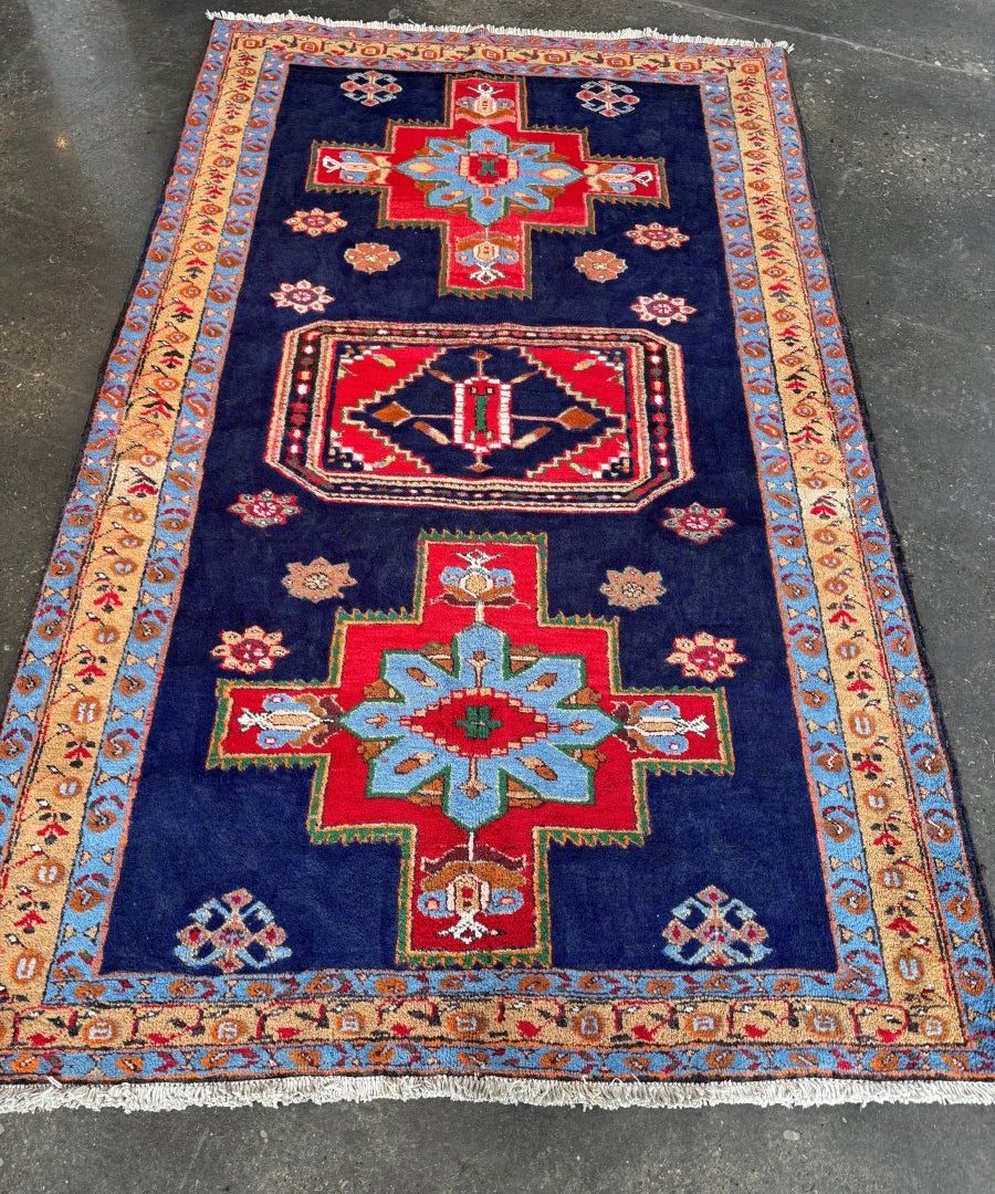 Persian Meshkin rug, navy field with red cross medallion and multicolor border