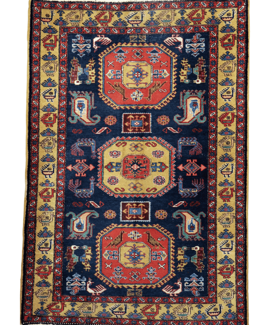 Persian mesh rug square flat lay with navy center, red medallions, and cream border