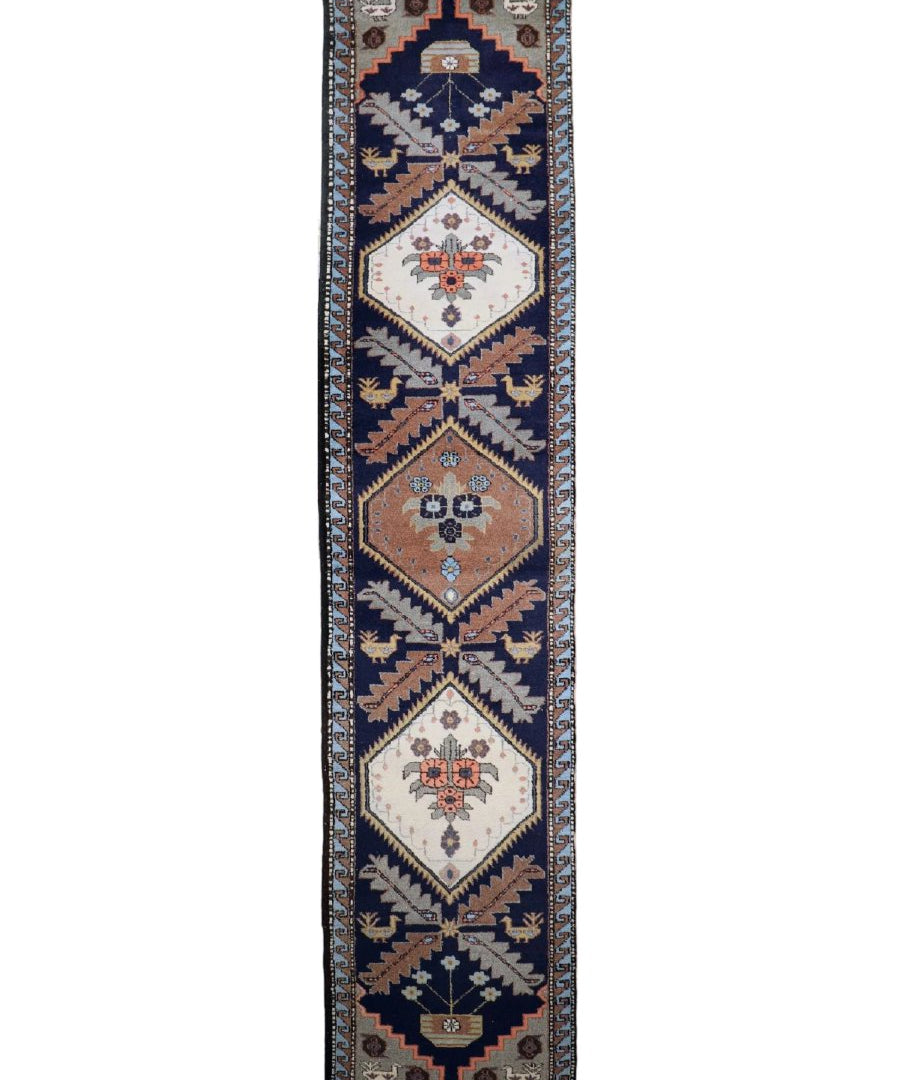 Persian Meshkin runner rug with geometric medallions in navy, cream, and rust tones