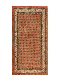 Persian rug with terracotta field, navy and cream geometric border and medallion details