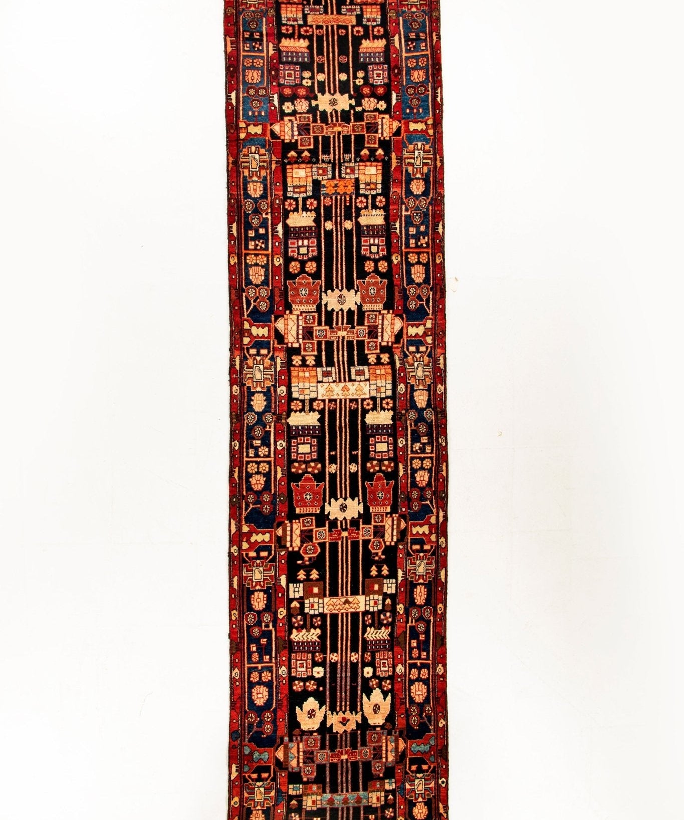 Persian runner rug, red and navy with cream motifs and repeating borders