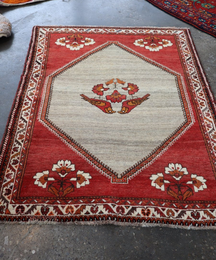 Persian Qashqai Gabbeh rug, red border with ivory ground and hex-style medallion