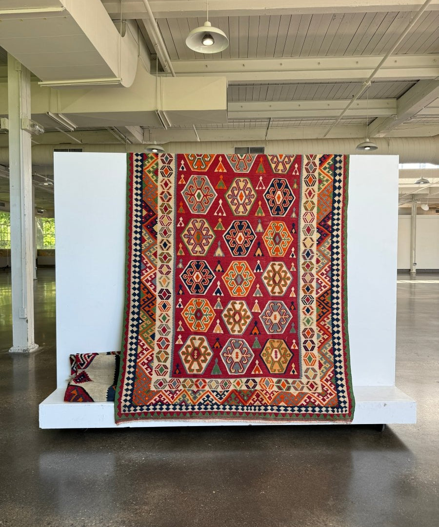 Persian Qashqai kilim rug with red, orange, blue and geometric pattern border