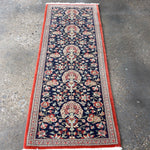 Persian Qom runner rug, navy with central medallion, floral vines, red edge border