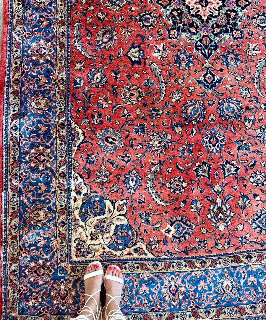 Persian Sarouk rug with red ground, blue floral medallions, bordered pattern