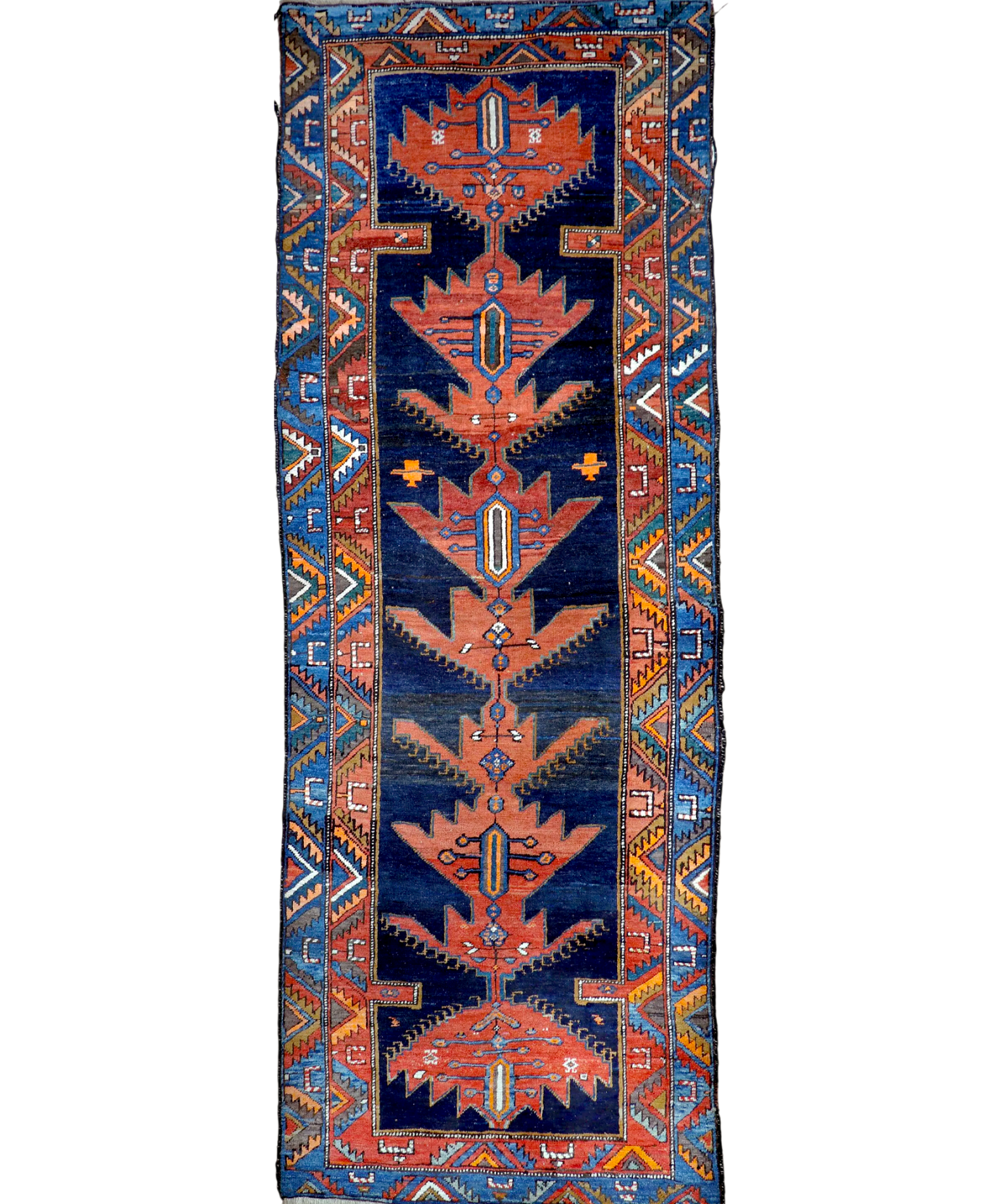 Navy and rust Persian-style runner rug with geometric medallion and border details