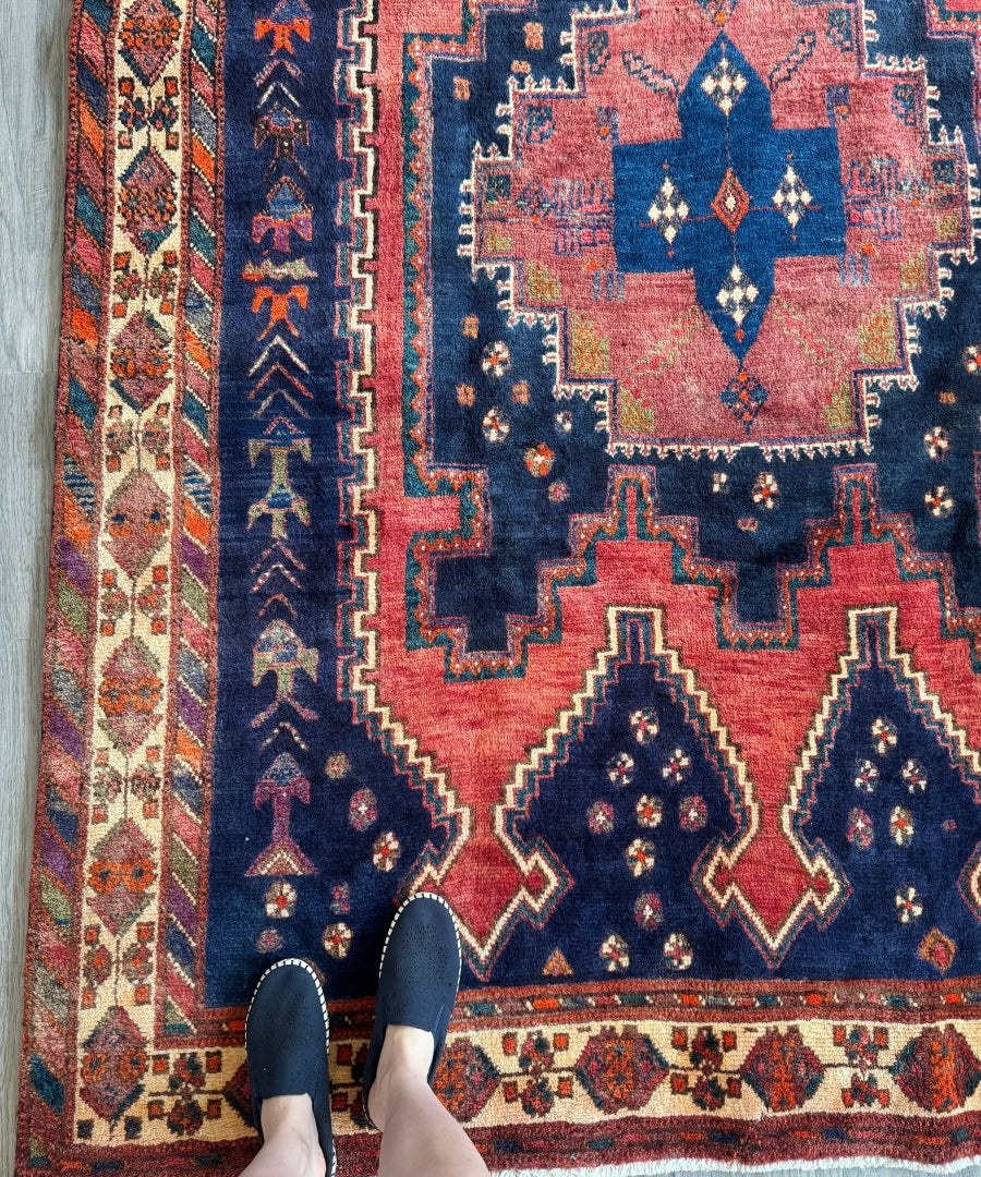 Persian Sirjan rug with navy blue, rust red, and cream geometric medallions