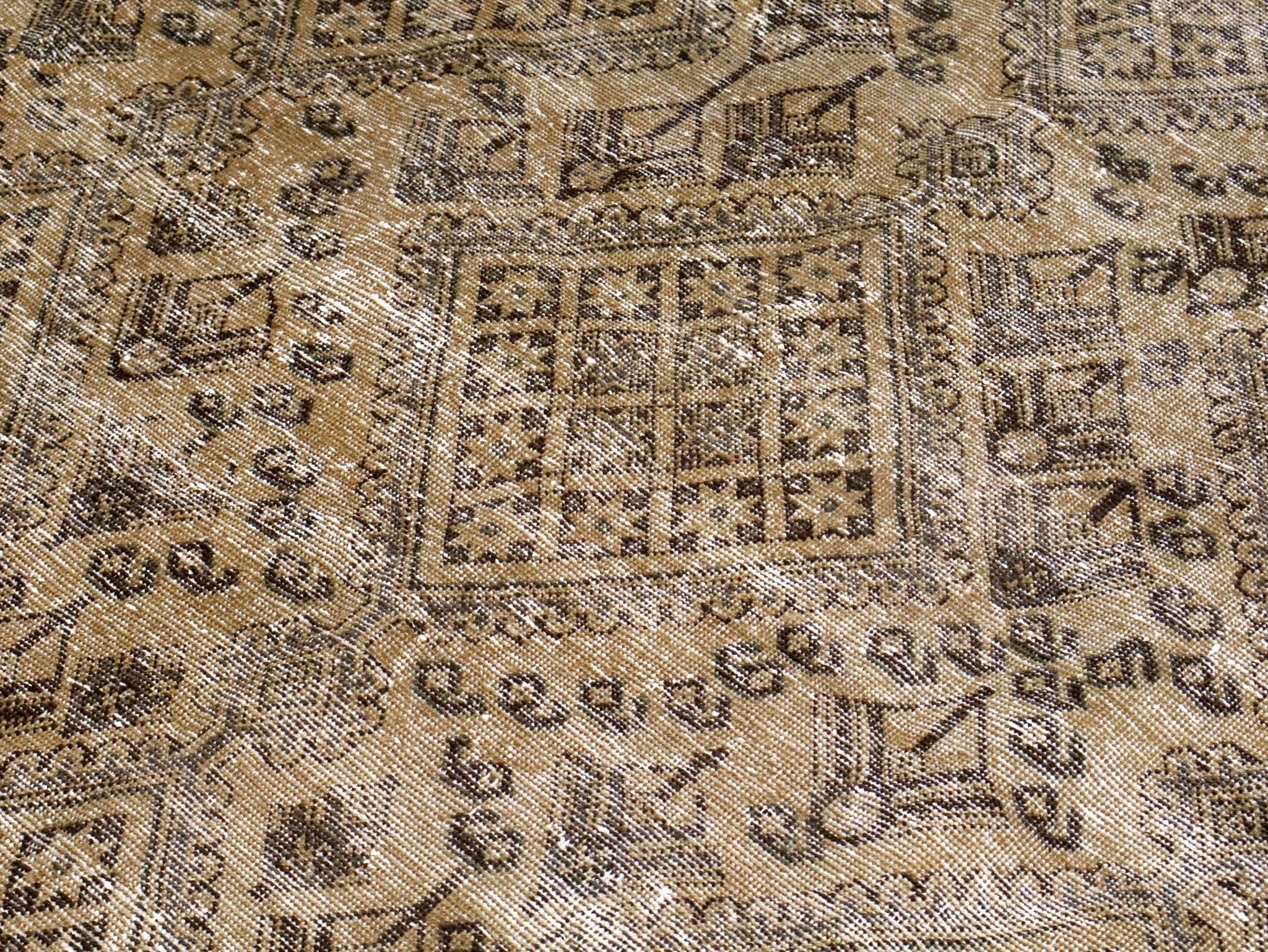 Beige and dark geometric pattern detail with repeating diamond medallions
