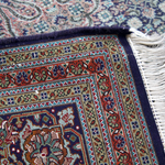Persian Tabriz rug folded edge with white fringes and multicolor geometric border