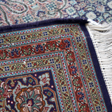 Persian Tabriz rug folded edge with white fringes and multicolor geometric border
