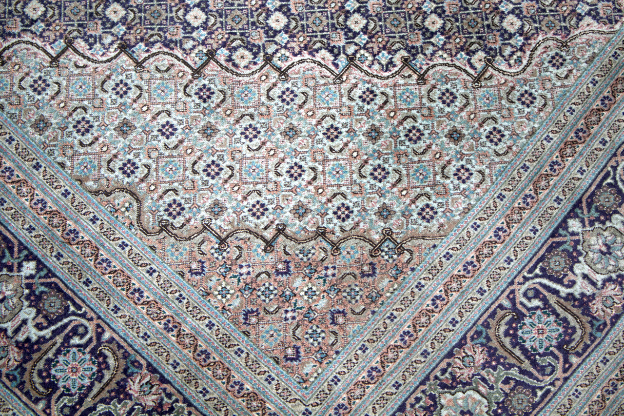 Persian Tabriz rug center medallion in pastel pink, teal, and navy