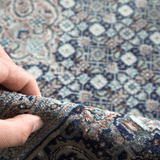 Persian Tabriz rug corner detail with hand pressing textured pile