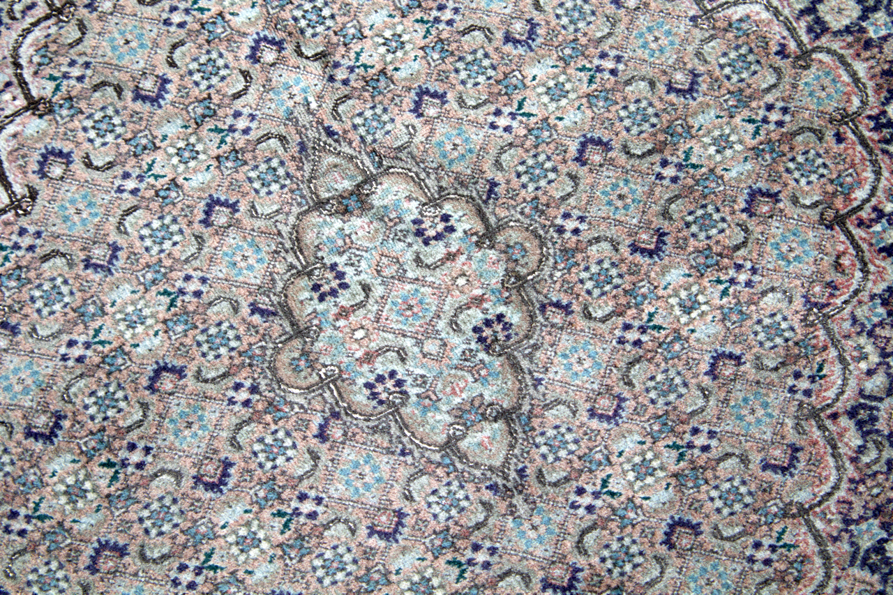 Persian Tabriz rug with central medallion and pastel speckled floral pattern
