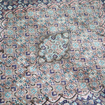 Persian Tabriz rug with central medallion and dense floral geometric field