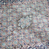 Persian Tabriz rug with central medallion and dense floral geometric field