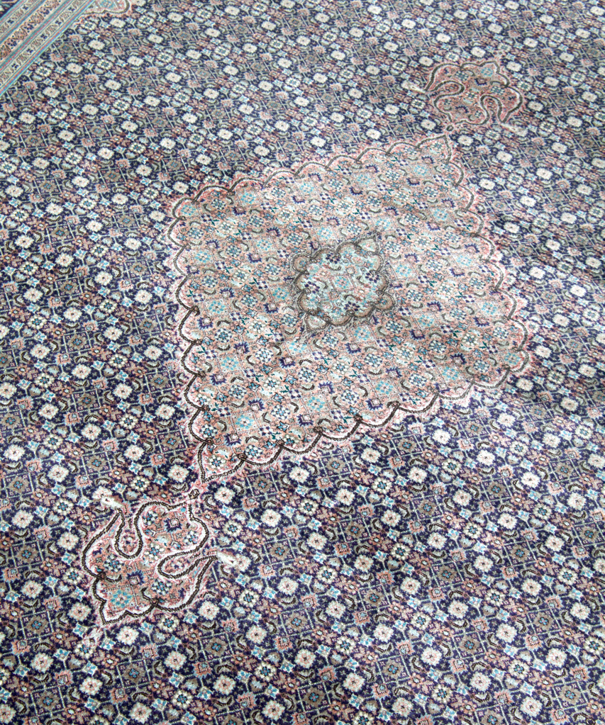 Persian Tabriz rug with light blue medallion and navy floral border