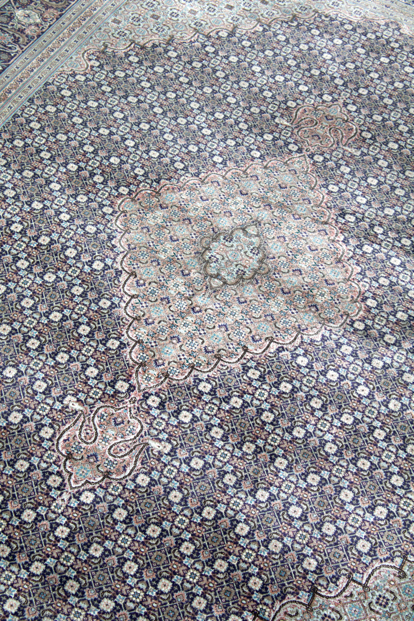 Persian Tabriz rug with light blue medallion and navy floral border