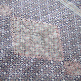 Persian Tabriz rug corner with pale central cartouche and blue floral pattern