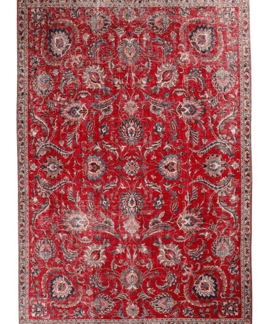 Red rug square-style with dense floral ornamentation, central medallion, and patterned frame.