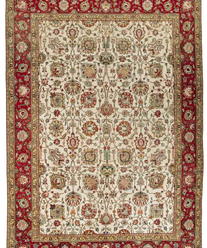 Persian Tabriz rug, full view with red border and beige medallion pattern
