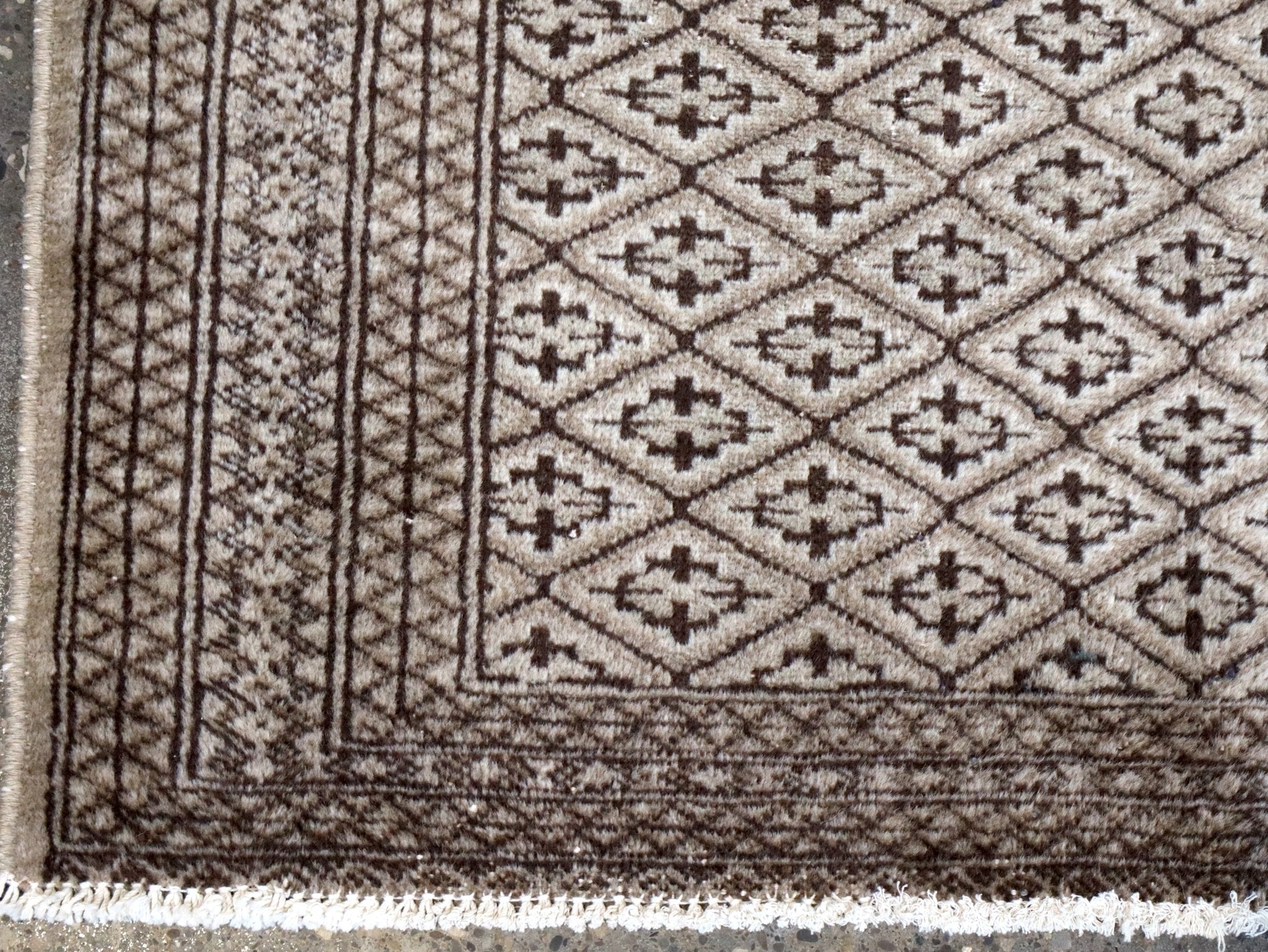 Persian Turkmen rug border design with vertical stripes and short fringed edge