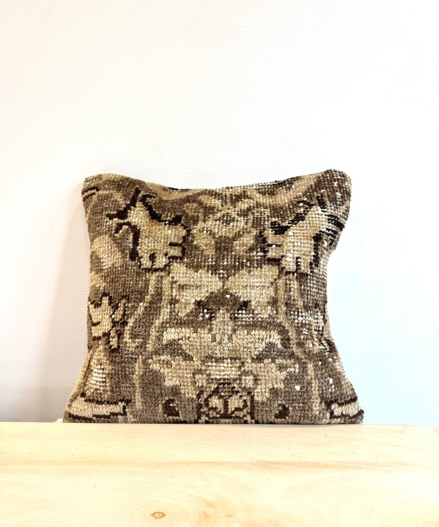 16 x 16 square woven pillow with beige and dark geometric pattern