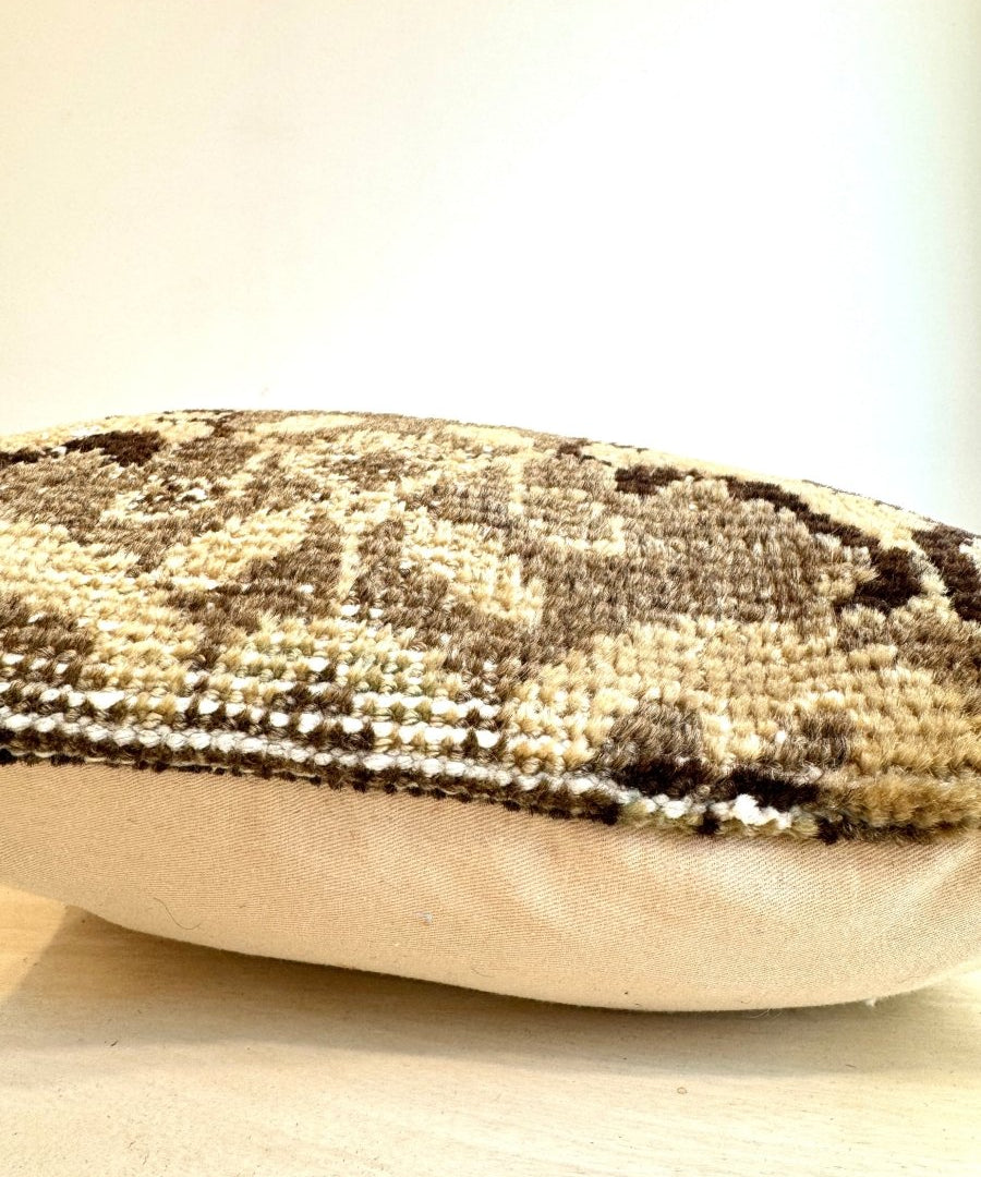 Woven square pillow with beige and dark abstract stripe texture