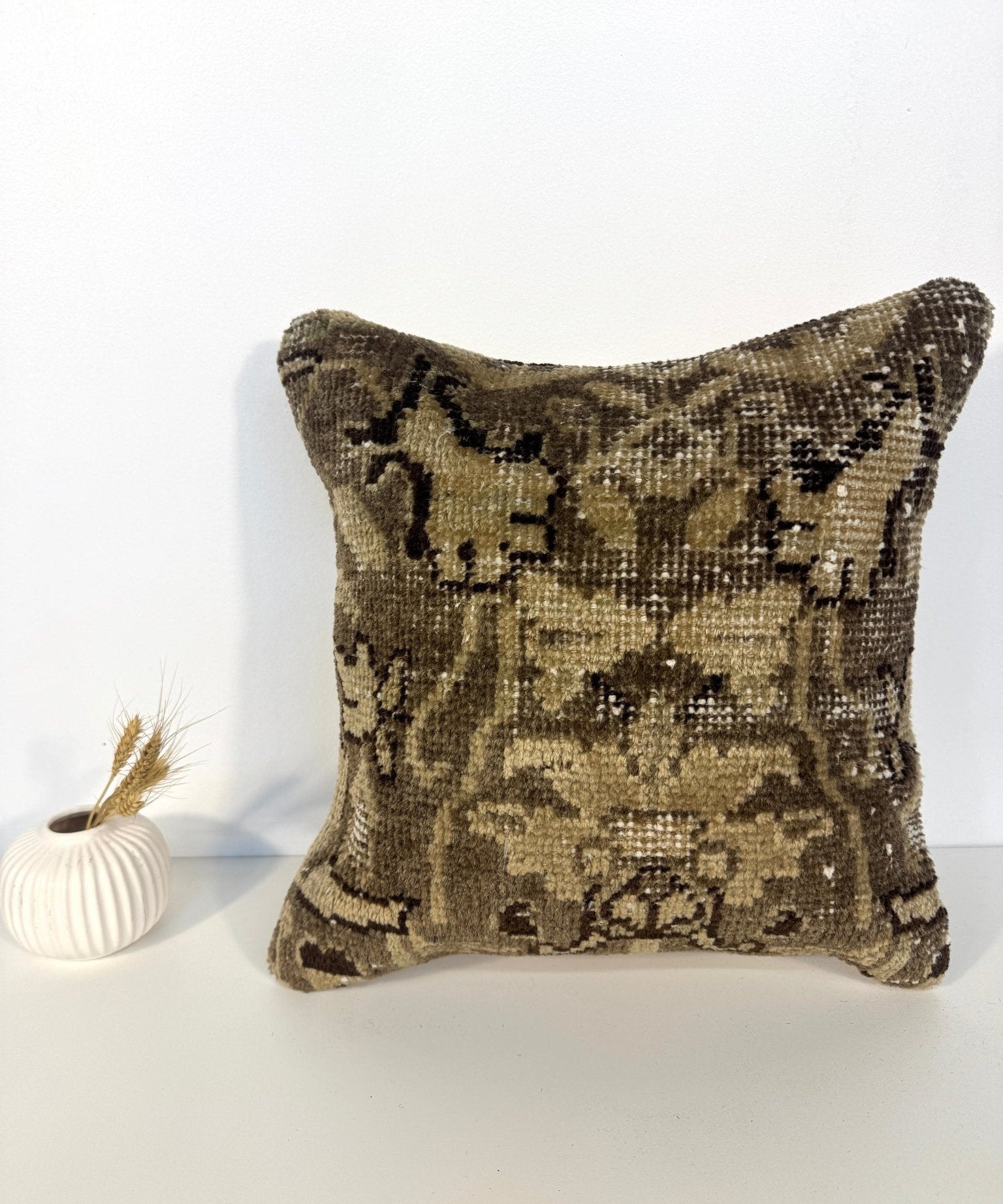 16 x 16 inch decorative pillow with olive and dark geometric pattern, textured woven fabric