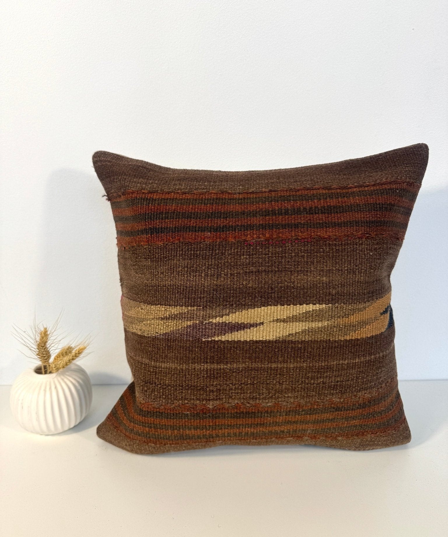 Woven pillow, 16 x 16 in, brown with orange and dark stripe bands