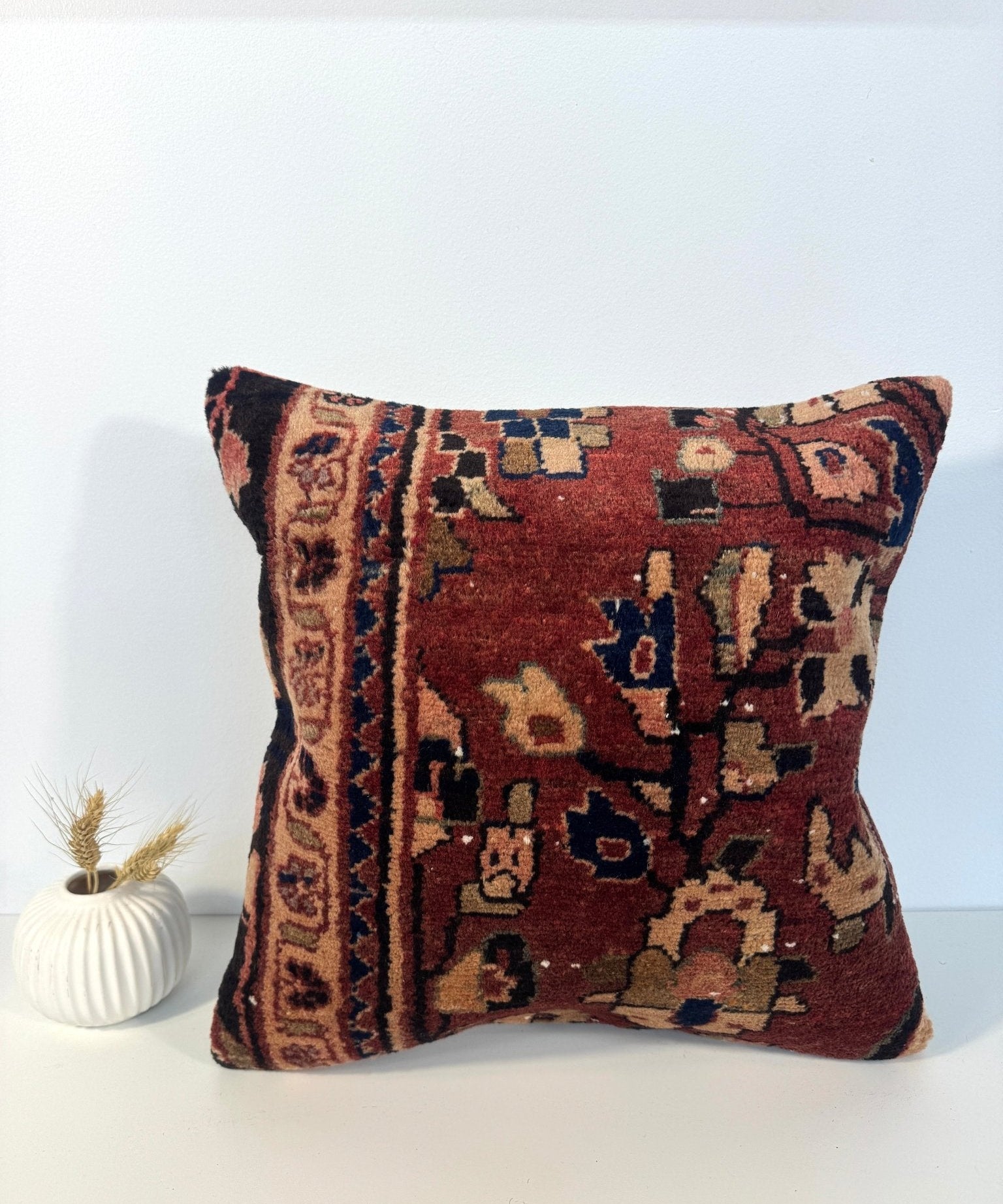 16x16 woven throw pillow with burgundy, navy, and tan geometric pattern front