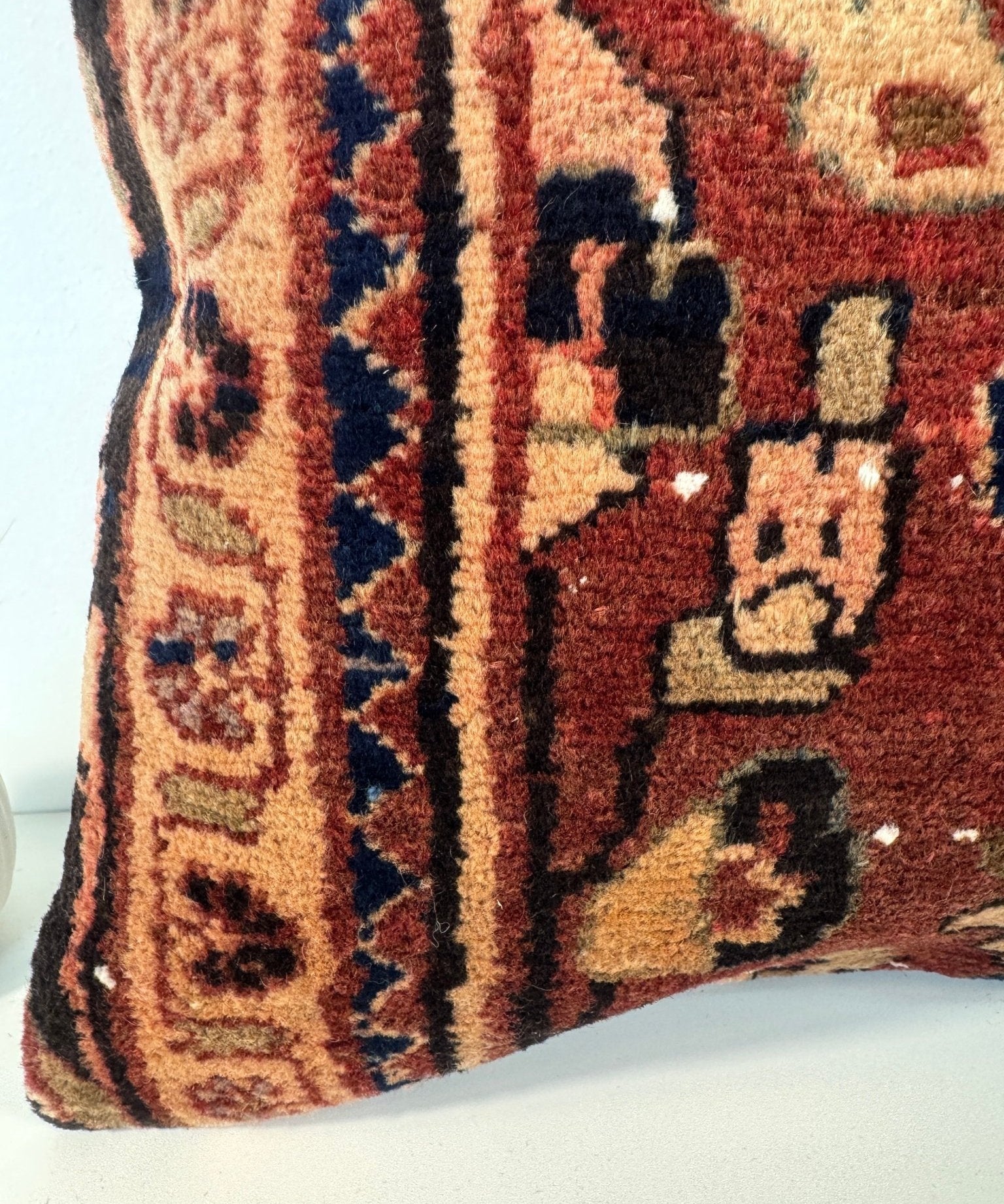 16x16 woven cushion with burgundy and tan geometric pattern, navy accents