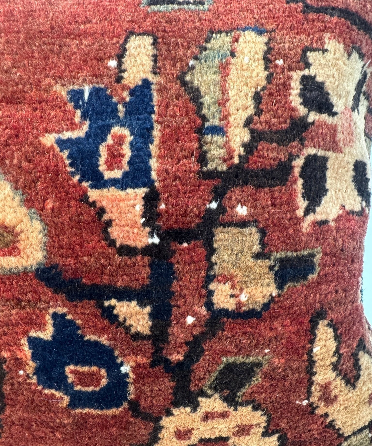 16x16 woven pillow close-up: burgundy geometric pattern with tan and navy shapes