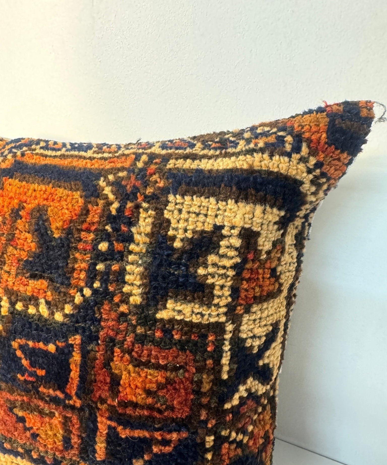 18 x 18 decorative pillow with bold geometric design in navy, orange, and yellow
