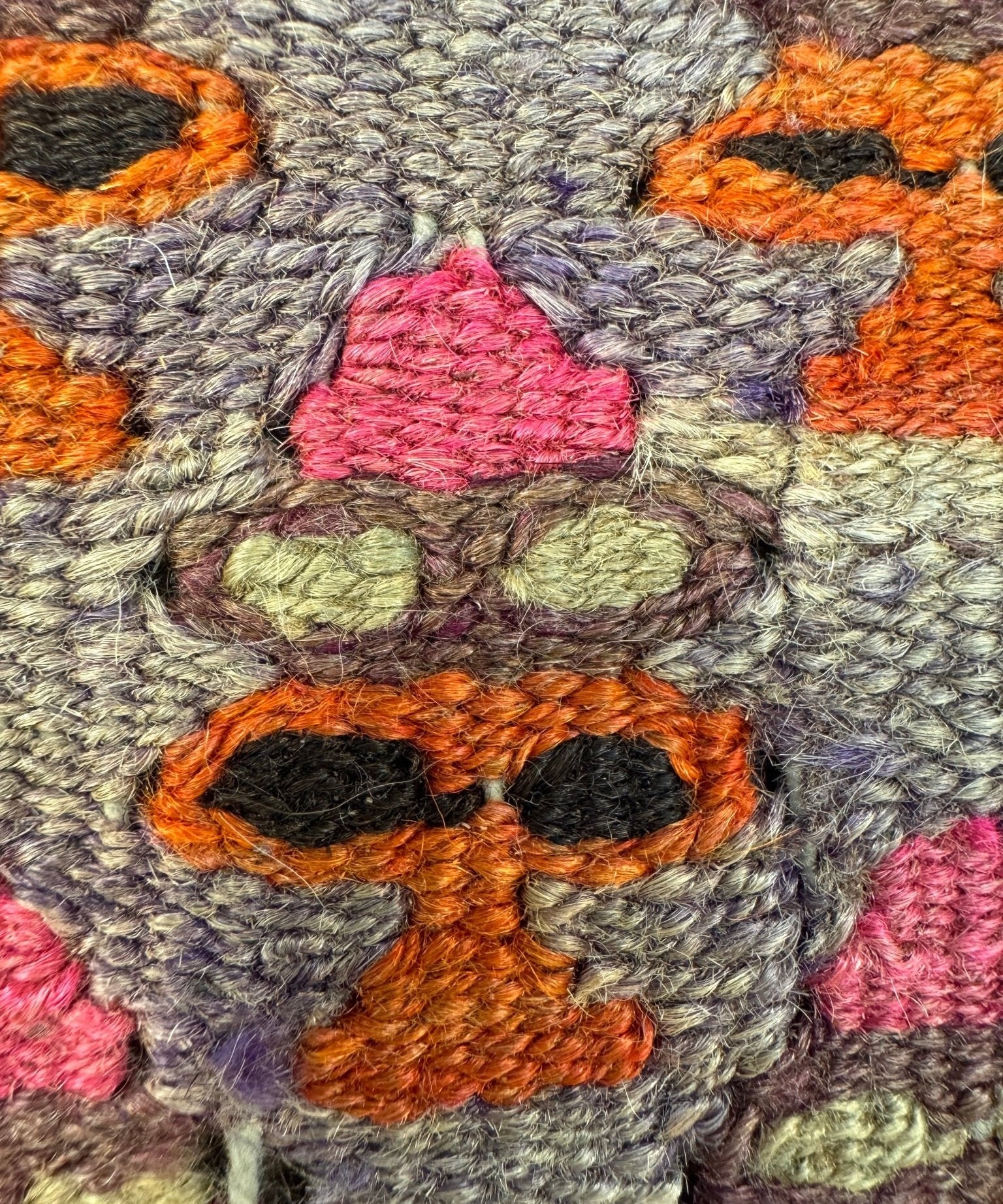 16x16 pillow fabric detail: chunky multicolor yarn geometric embroidery on gray